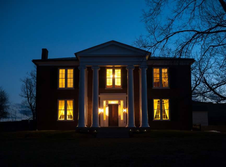 View of front of the house at night